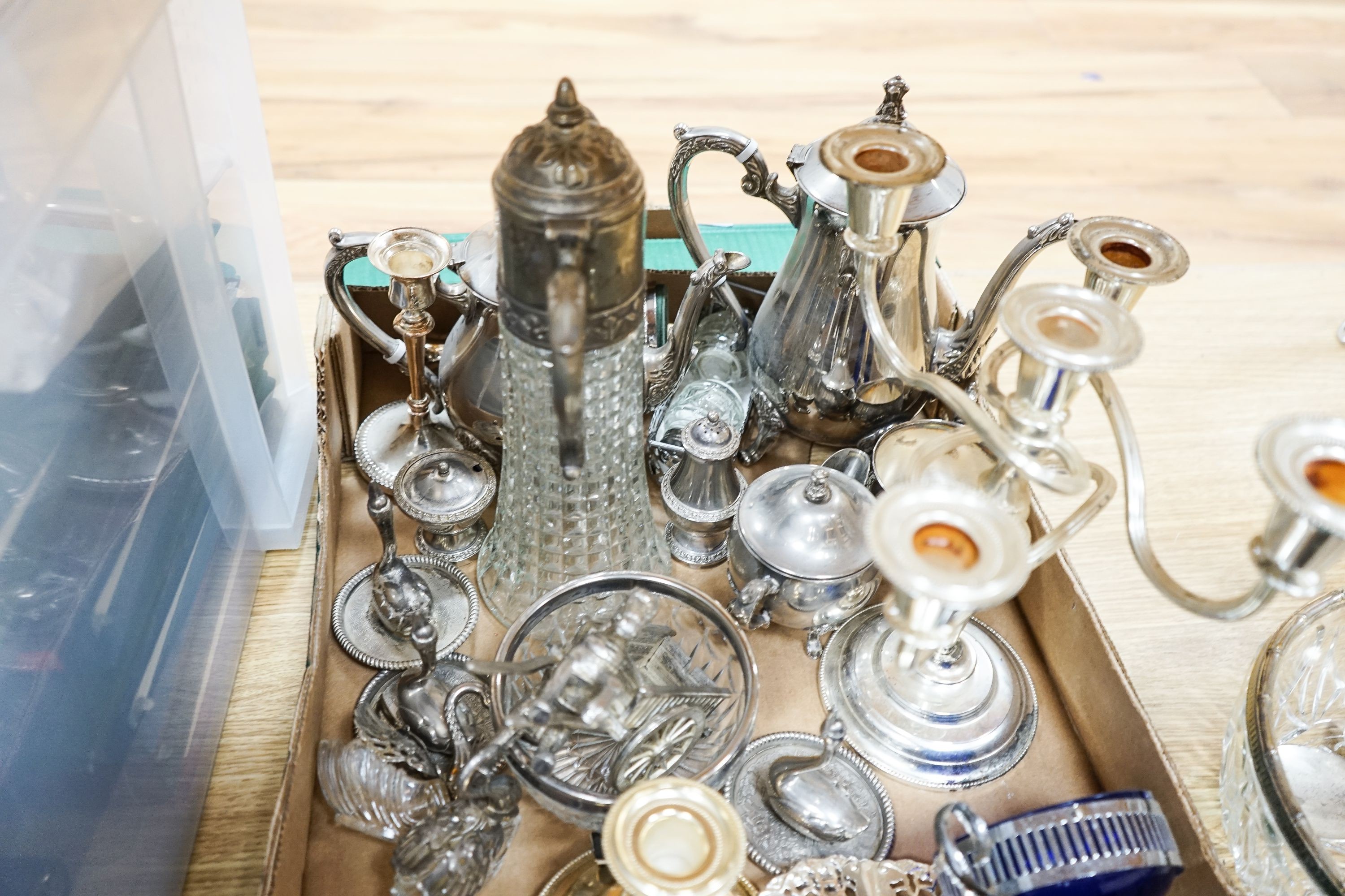 Mixed silver plated wares including a 5 light candelabra, swan salts, tea pot, coffee pot, peppers, menu holders etc.